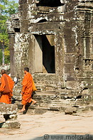 15 Buddhist monks walking in Bayon