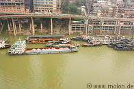 03 Cargo ships along riverbank and elevated road