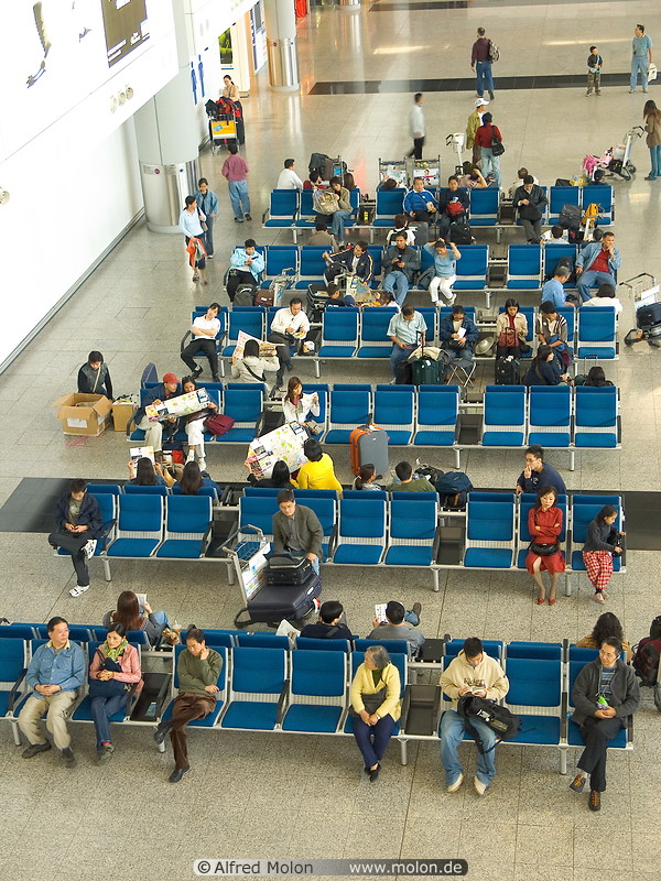 04 Travellers sitting in waiting area