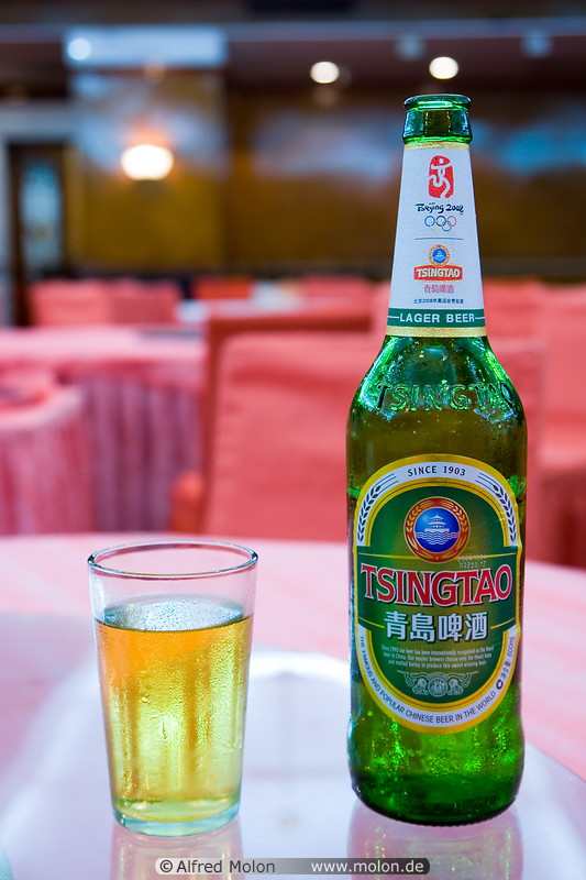 11 Green Tsingtao beer bottle and glass