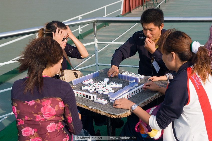16 Chinese tourists playing Mahjong