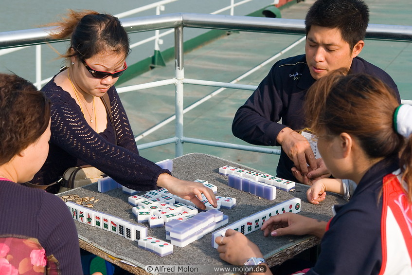 17 Chinese tourists playing Mahjong