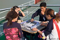 16 Chinese tourists playing Mahjong