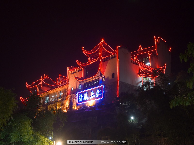 01 Temple facade illuminated with red neon lights at night