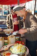 08 Man preparing noodle dish in Upal