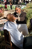 03 Uighur barber shaving customer