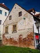 27 House facade with sundial