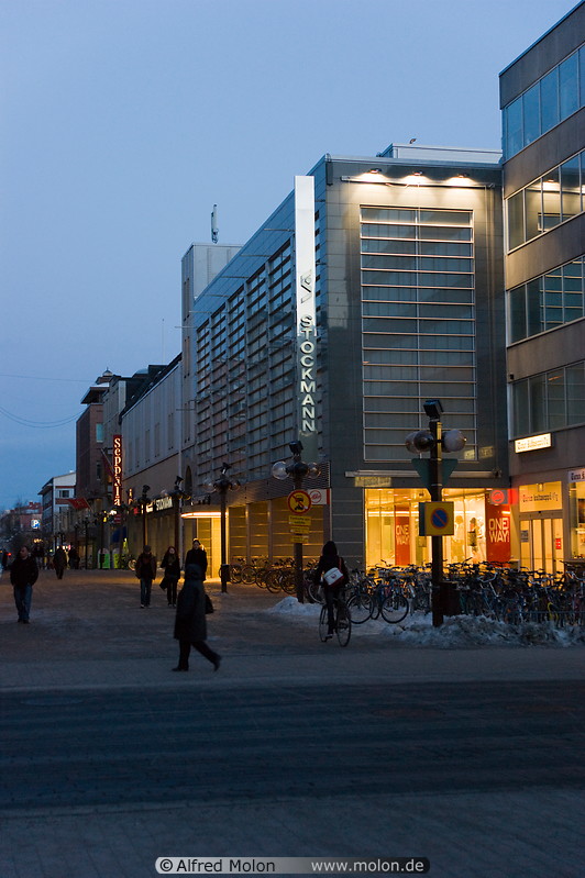 12 Pedestrian area with shops at dusk