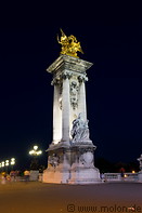 18 Gilded statue on column