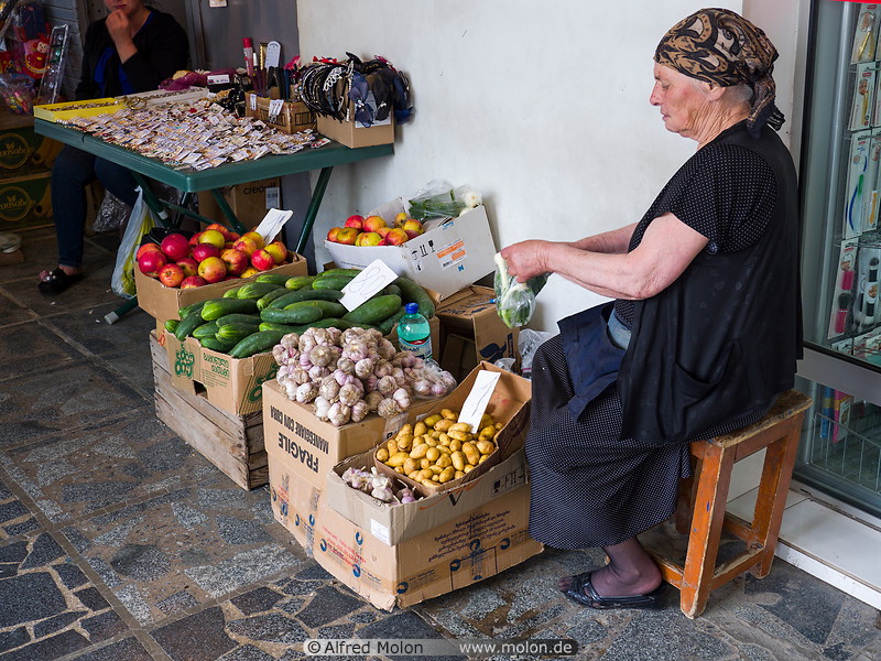 22 Old woman selling vegetables
