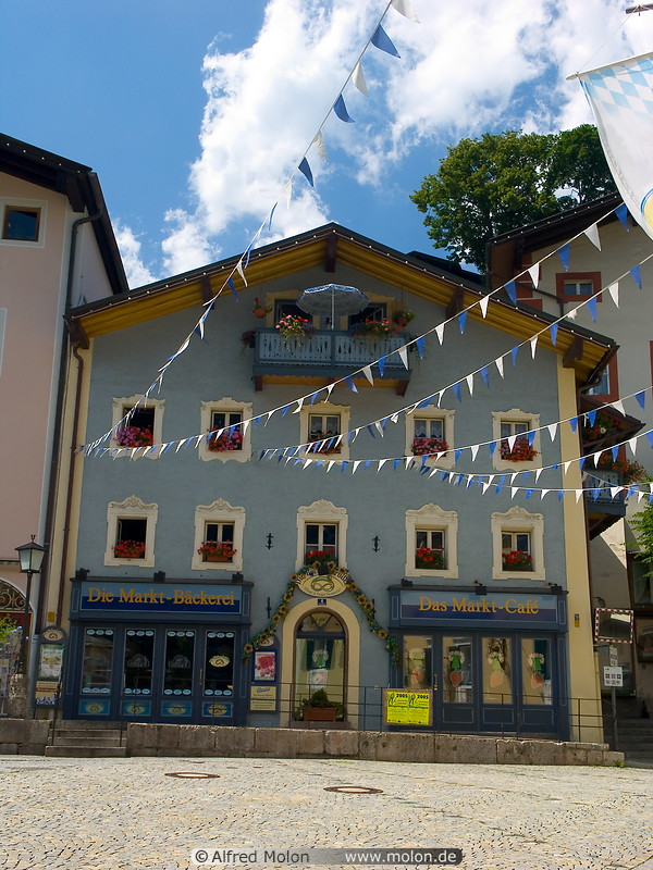 01 Bavarian style house with white and blue flags