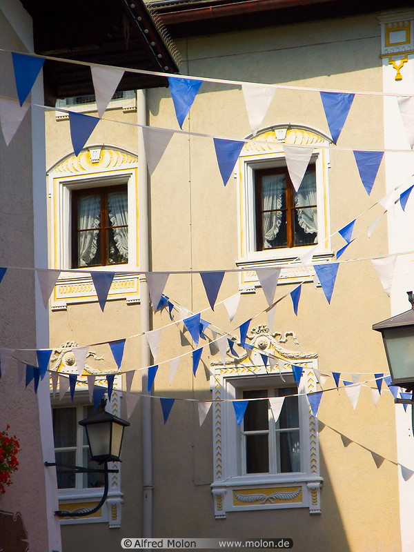05 Bavarian style house with white and blue flags