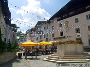 02 Pedestrian area with restaurant and white and blue flags