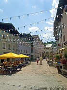 03 Pedestrian area with restaurant and white and blue flags