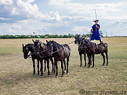 19 Hungarian horsemen standing on horses