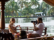 28 Man on houseboat taking photo of woman