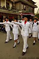 15 Boys and girls marching in white uniforms on National Day