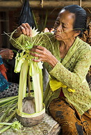34 Old Balinese woman preparing god offering