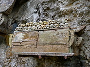 31 Coffins hanging from rock face