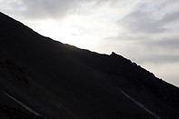04 Sun rising behind mountain slope