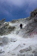 34 Hiker among summit crater rocks