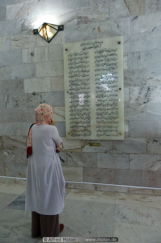 13 Iranian woman watching stone inscription