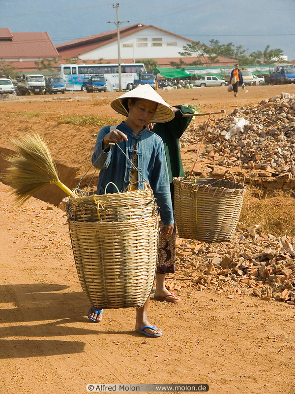 14 Lao people carrying baskets
