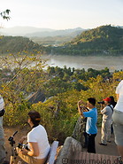 14 Tourists on Phu Si hill waiting for the sunset