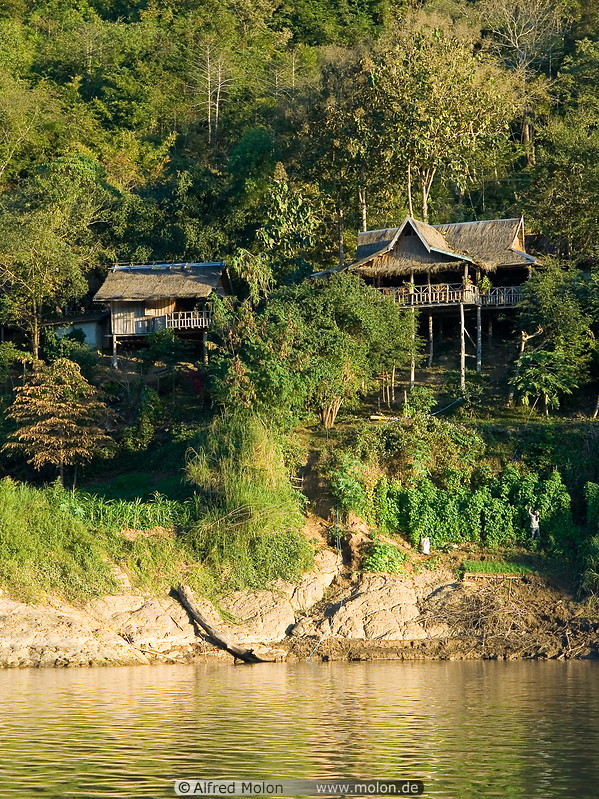 18 Houses on stilts along riverbank