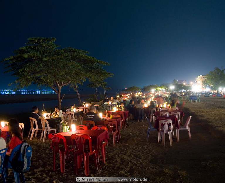 14 Restaurant tables along Mekong river at night