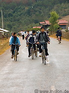 21 Schoolchildren riding bicycles back home