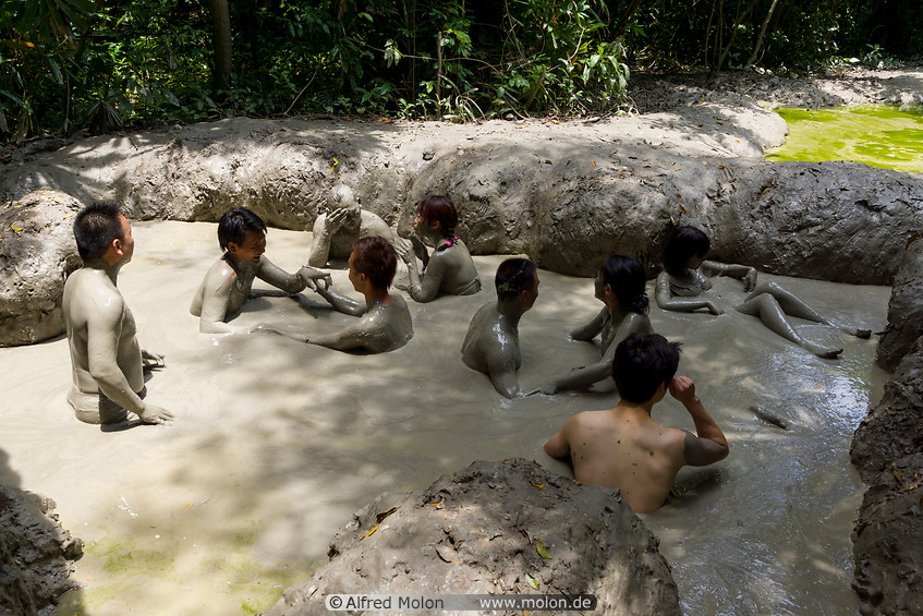 07 Tourists bathing in mud volcano