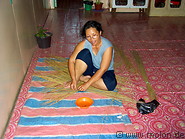 21 Kayan woman weaving a mat