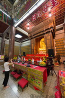 14 Woman praying to Buddha