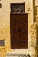 16 Decorated brown door and yellow wall