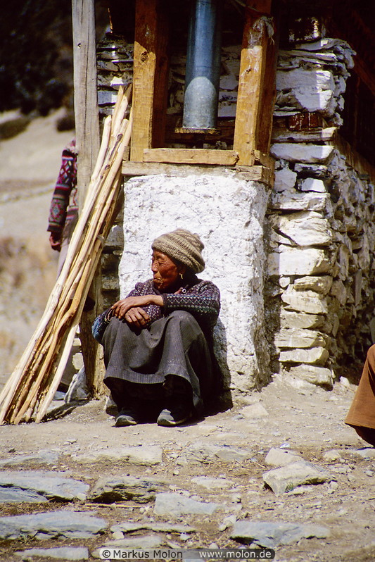 02 Tibetan woman selling walking sticks