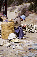 03 Tibetan woman selling handicraft objects