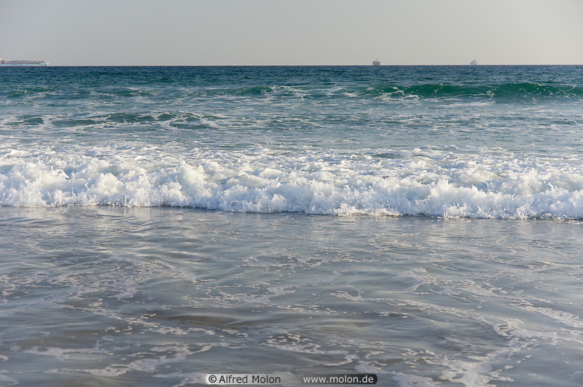 30 Waves breaking on sandy beach