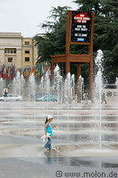 03 Child playing among fountains