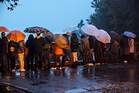 15 Tourists waiting for the sunrise in the rain
