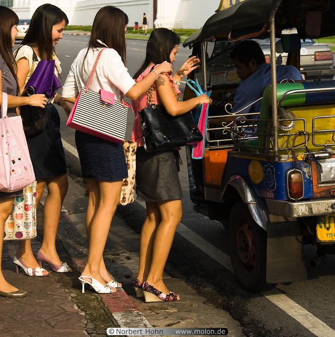15 Thai girls boarding tuk-tuk