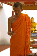 12 Buddhist monk using mobile phone