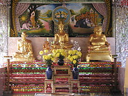04 Golden Buddha statues and flowers