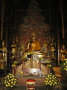 13 Buddha statue and yellow flowers