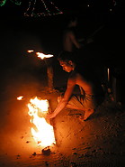38 Performer with torch on the beach at night