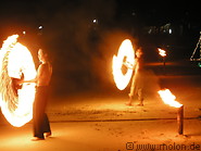 39 Performers with torches on the beach at night