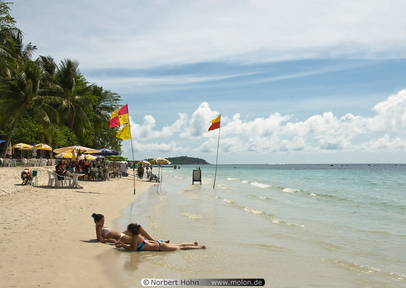 31 Tourists sunbathing on beach