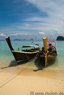 19 Long tail boats anchored on beach
