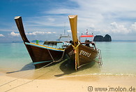 20 Long tail boats anchored on beach