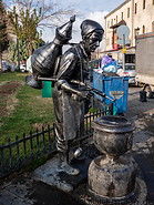 51 Man selling water statue